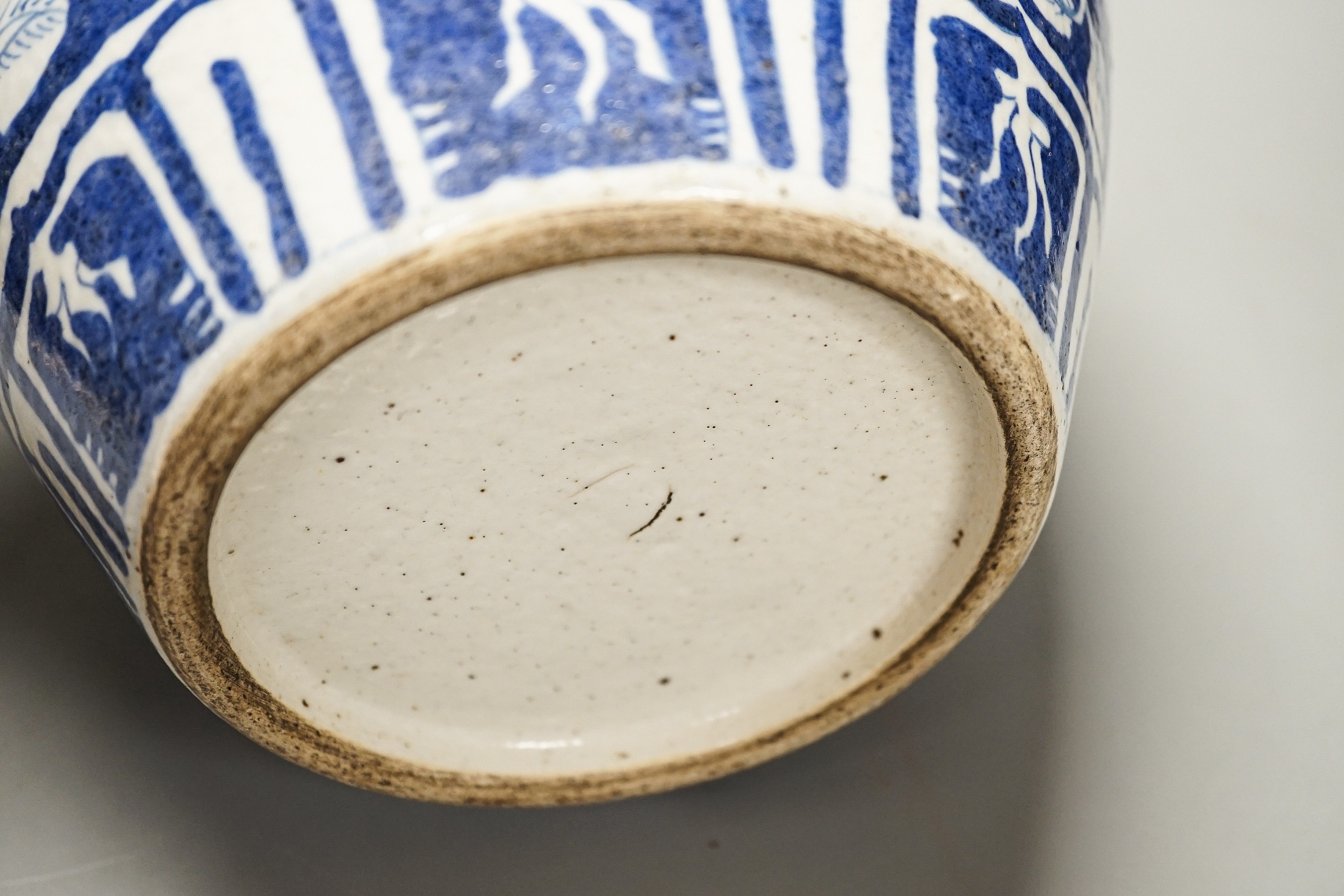 A Chinese blue and white ovoid jar, 19th/20th century, painted with dragons amid flowers and foliage, 33 cms high.